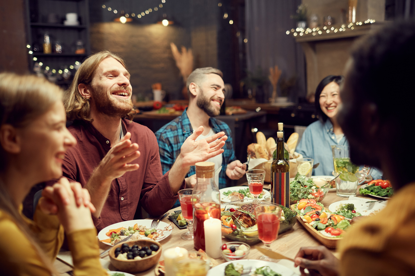 People Laughing at Dinner Table